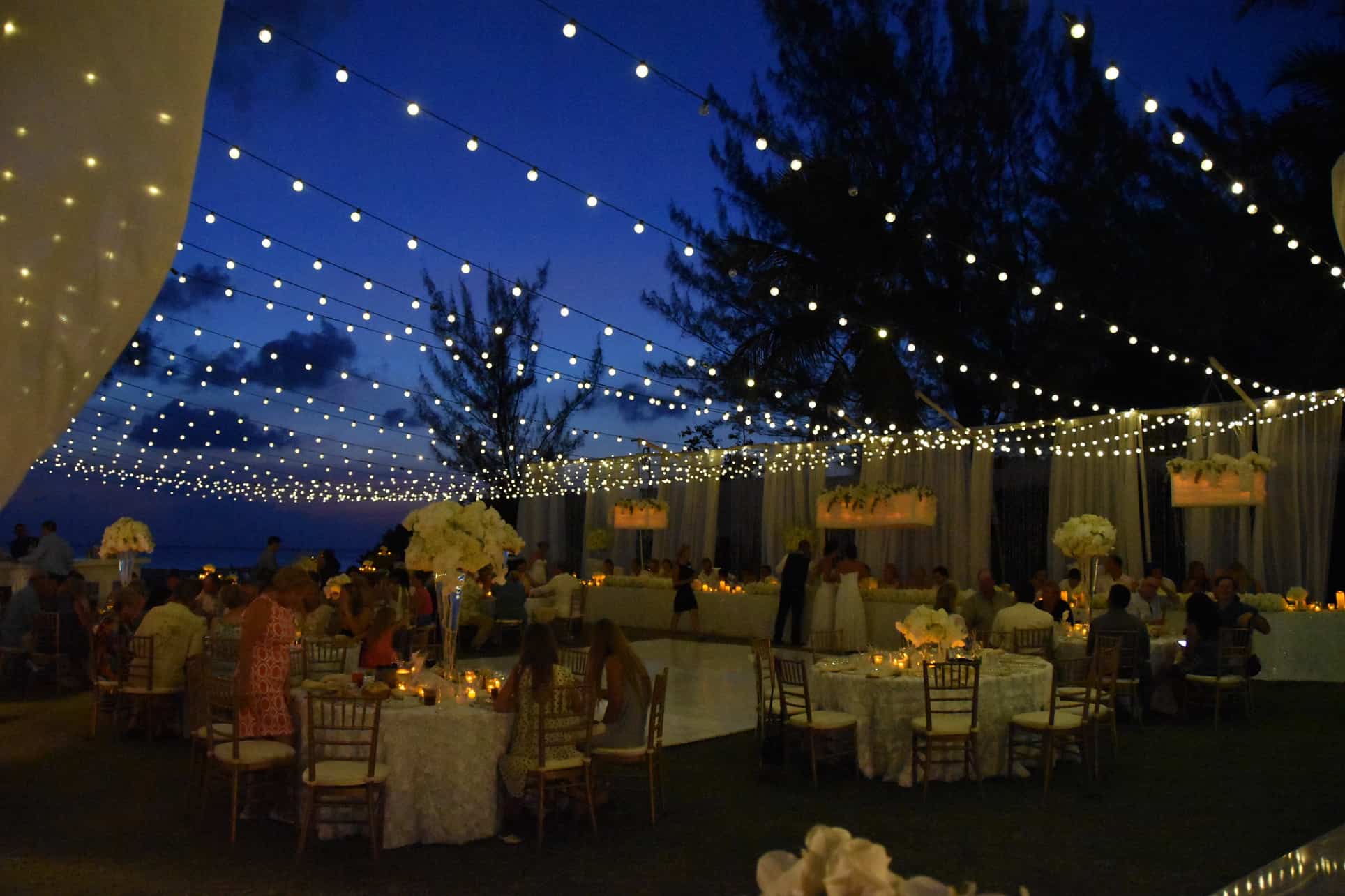 wedding under the moonlight reception beach, twinkle lights, fairy lights, party globe lights